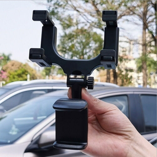 Universal 360 Rotation Car Rear View Mirror Mount Stand GPS Cell Phone in a person's hand