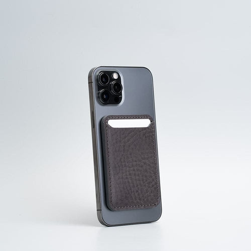 Full-Grain Leather Wallet compatible with MagSafe - Classic attached to an iPhone.