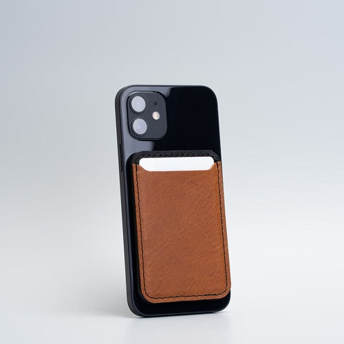 Leather Wallet compatible with MagSafe - Two colors attached to a smartphone in brown leather.