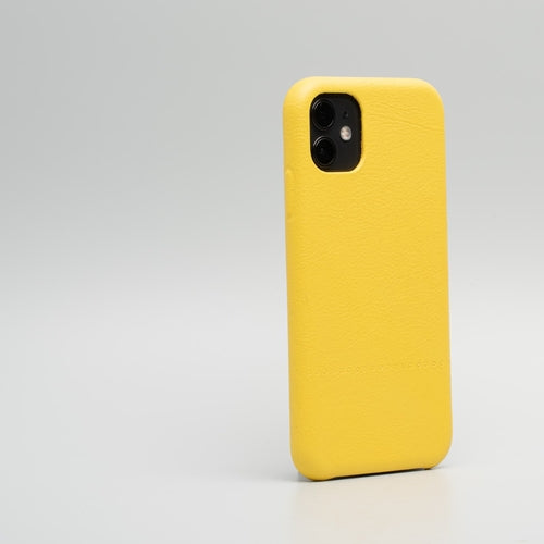 iPhone 11 Yellow leather case - Drops viewed from the back with a minimalist design.